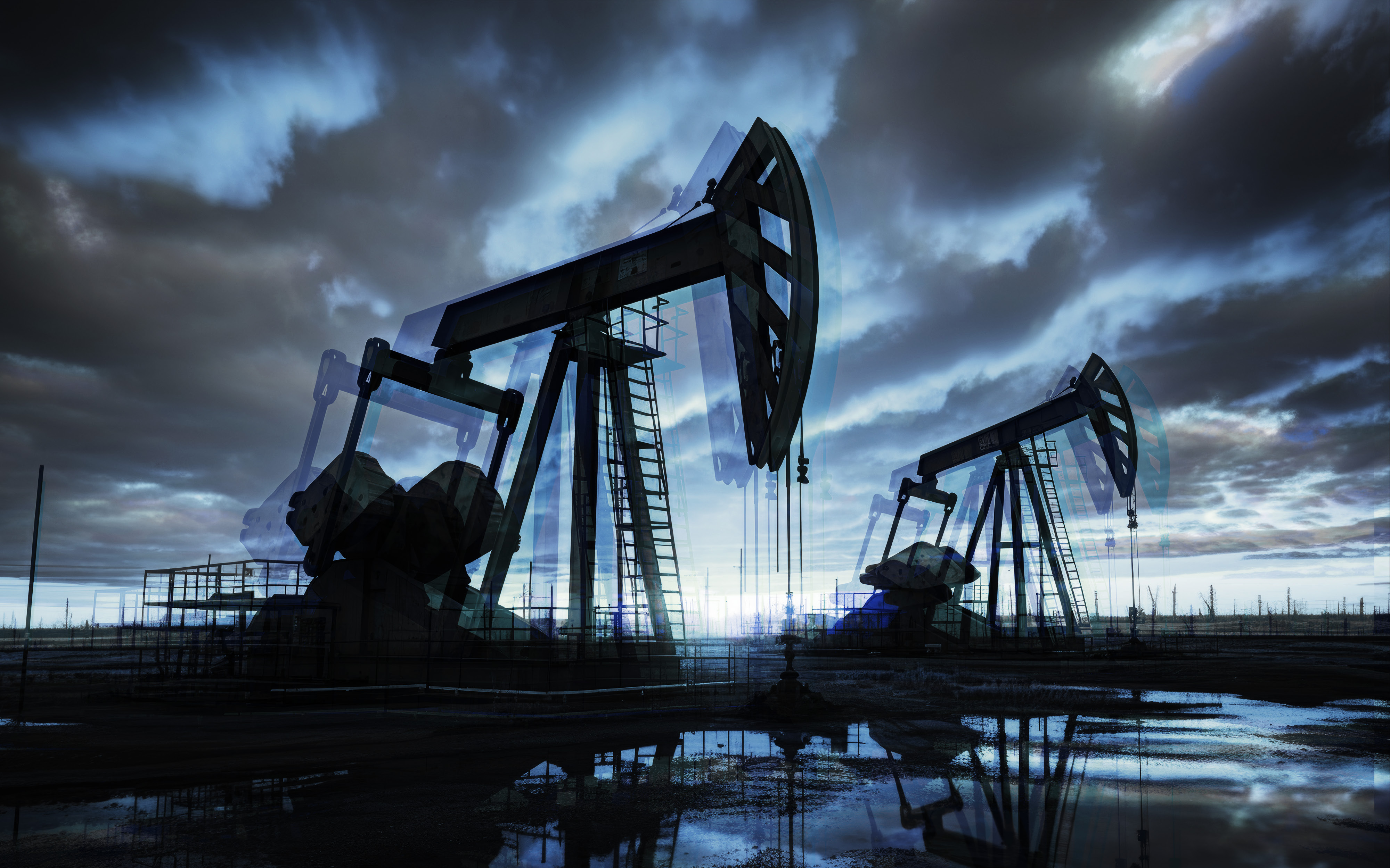 Oilfield pumpjacks under a dramatic sky